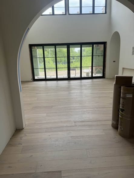 White oak floor with curved archway framing