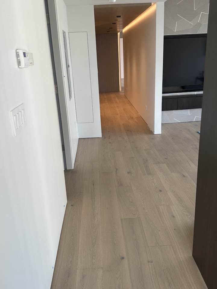 Finished hardwood flooring in a bright MGM Chicago high-rise living space