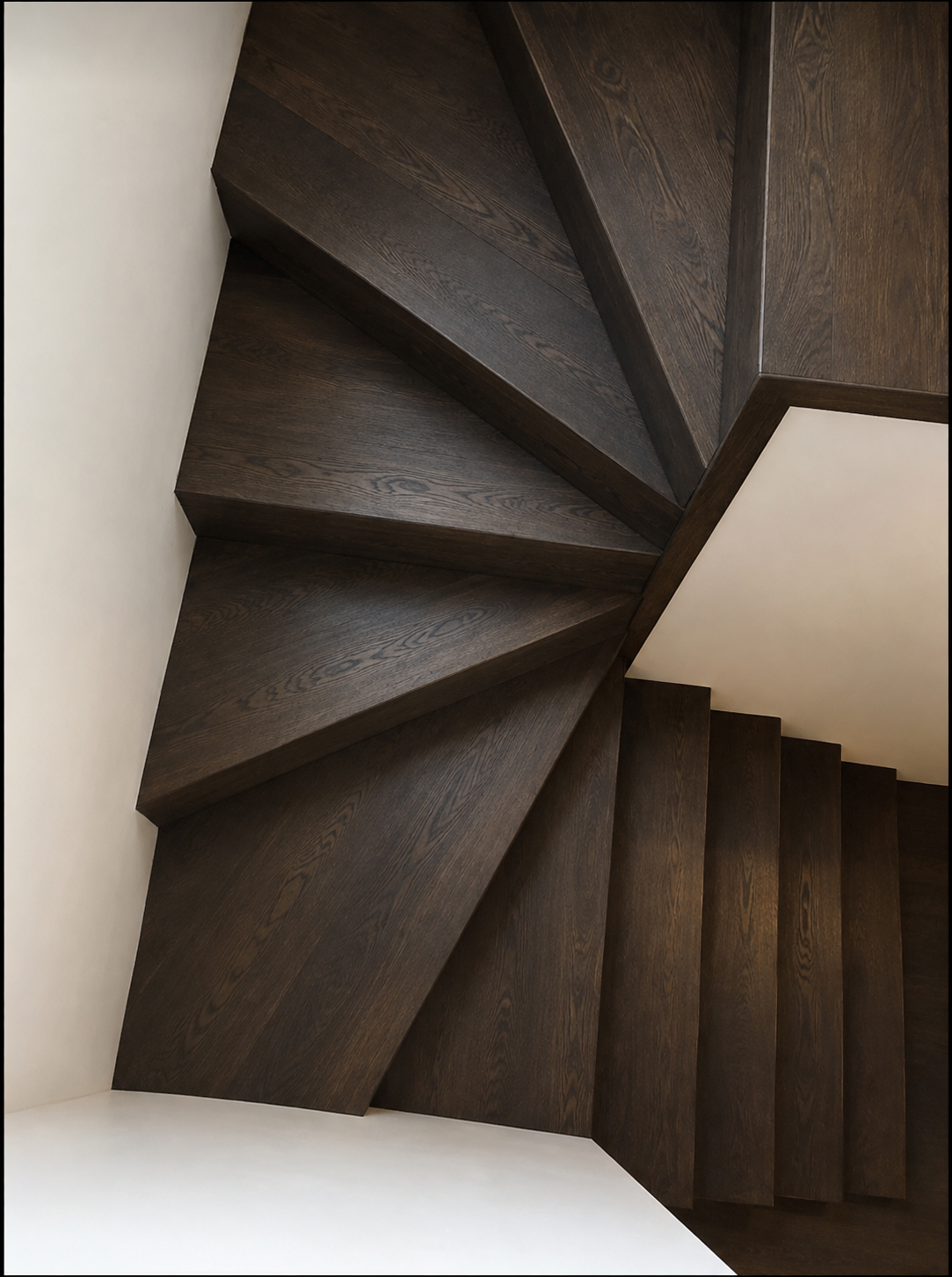 The same staircase after refinishing with a dark wood stain